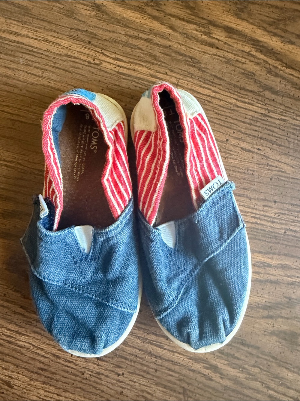 Toms Kids Slip-On Sneakers in Blue with Red Stripe Lining